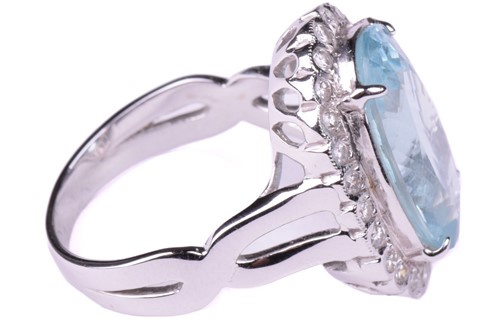 Lot 24 - An aquamarine and diamond cluster ring, set...