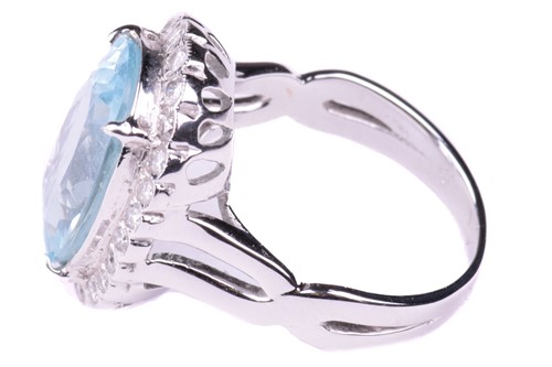 Lot 24 - An aquamarine and diamond cluster ring, set...