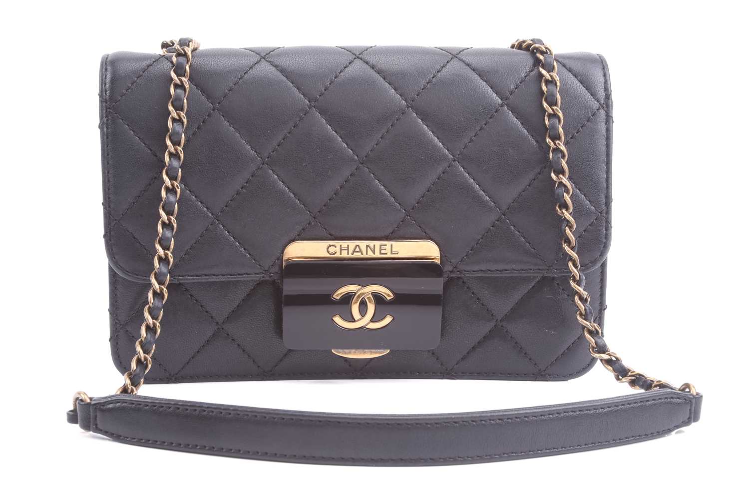Lot 48 - Chanel - a mini Beauty Lock flap bag in black...