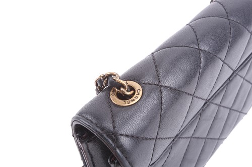 Lot 48 - Chanel - a mini Beauty Lock flap bag in black...
