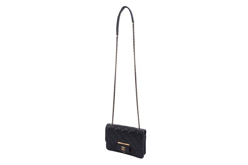 Lot 48 - Chanel - a mini Beauty Lock flap bag in black...