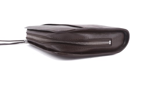 Lot 22 - Louis Vuitton - a clutch bag in dark brown...