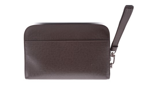 Lot 22 - Louis Vuitton - a clutch bag in dark brown...