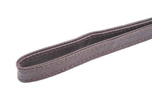 Lot 22 - Louis Vuitton - a clutch bag in dark brown...