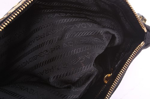Lot 55 - Prada - a bejewelled 'Whips Pietre' clutch in...