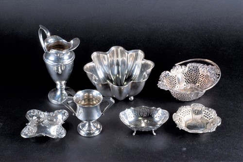 Lot 354 - A pierced silver swing handle sweet basket,...