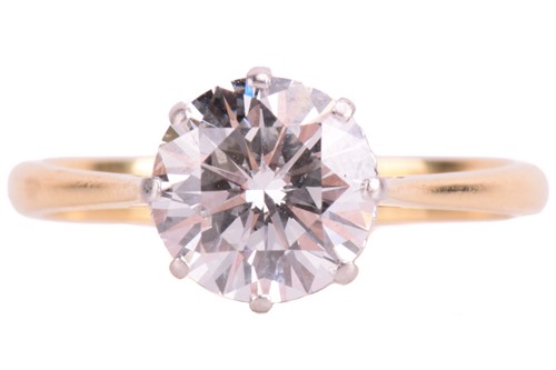 Lot 182 - A diamond solitaire ring set with a round...