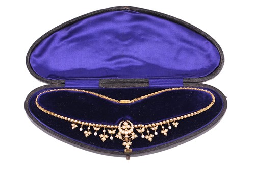 Lot 1 - A late Victorian seed pearl necklace featuring...