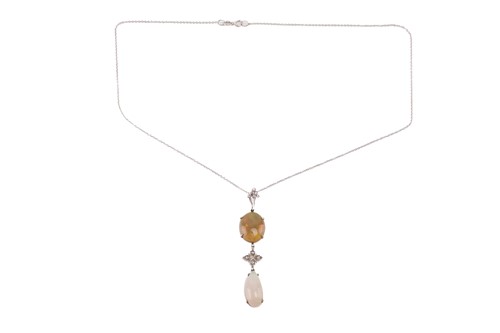 Lot 5 - An opal and diamond pendant set with a...