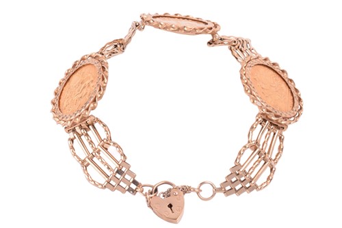 Lot 110 - A 9ct gold gate link bracelet mounted with...
