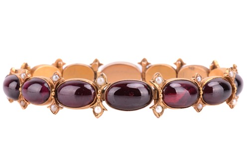 Lot 212 - A Victorian garnet and seed pearl bracelet,...