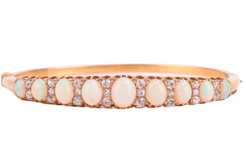 Lot 38 - A Victorian opal and diamond hinged bangle,...