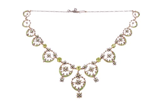 Lot 48 - An Edwardian diamond, peridot and demantoid...