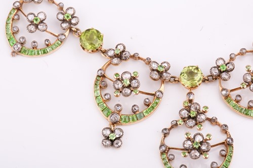Lot 48 - An Edwardian diamond, peridot and demantoid...