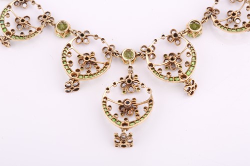 Lot 48 - An Edwardian diamond, peridot and demantoid...