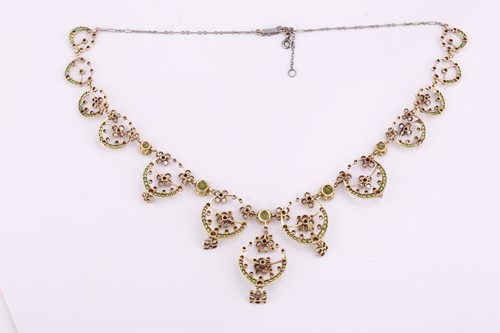 Lot 48 - An Edwardian diamond, peridot and demantoid...