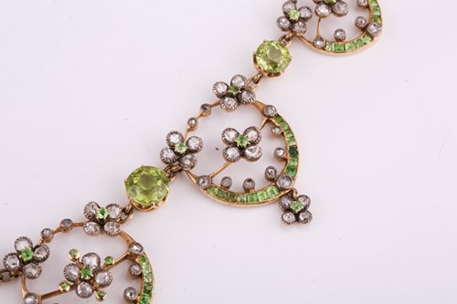 Lot 48 - An Edwardian diamond, peridot and demantoid...