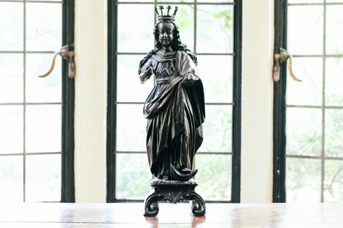 Lot 12 - A Northern European stained limewood carved...
