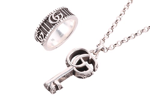 Lot 174 - Gucci - a 'Double G' key silver necklace and...