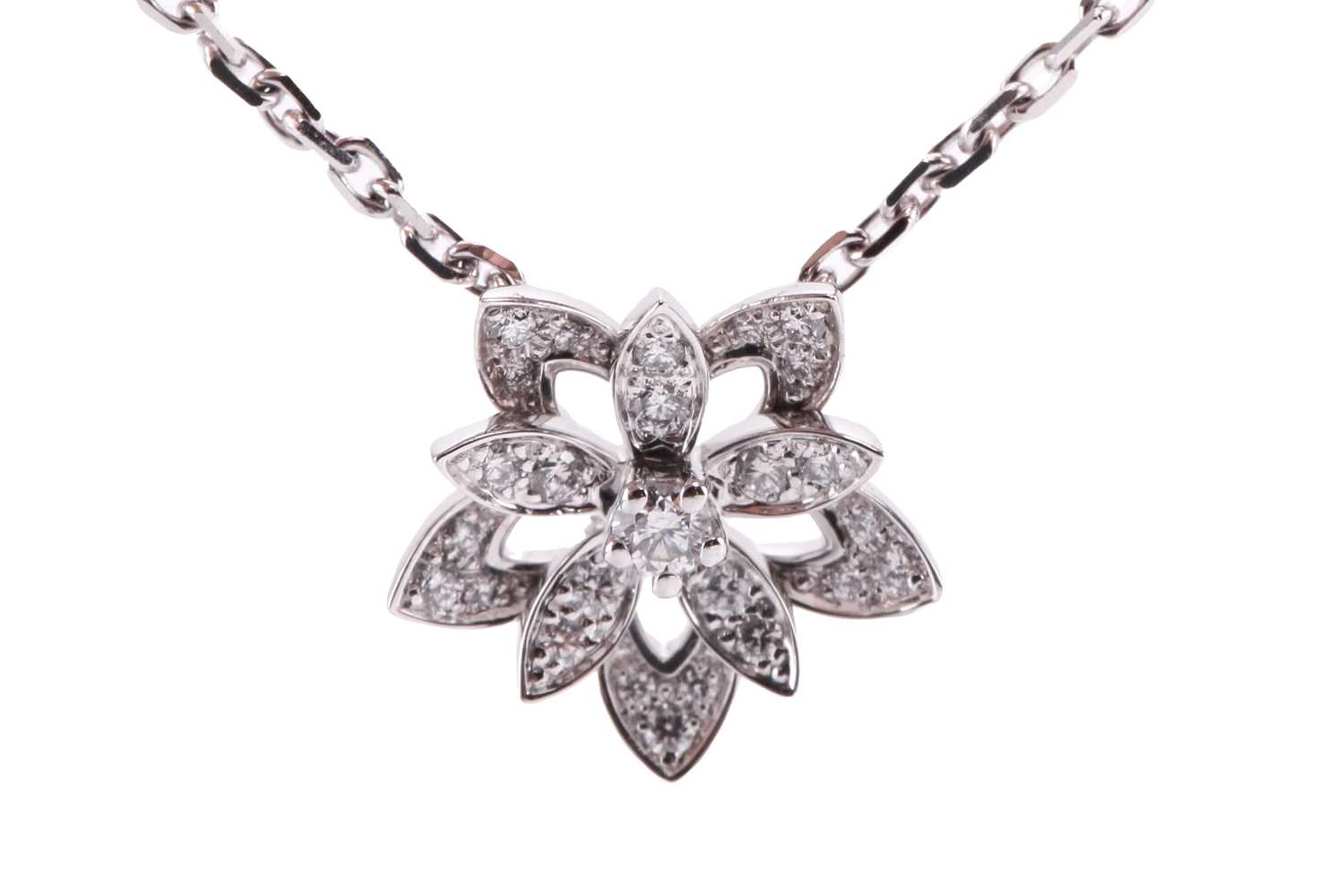 Lot 304 - Van Cleef & Arpels - a diamond-set lotus...
