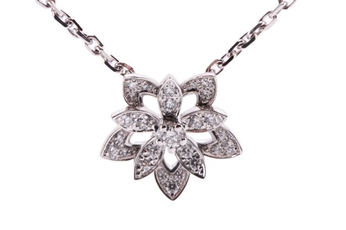 Lot 304 - Van Cleef & Arpels - a diamond-set lotus...