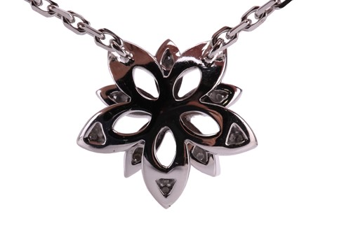 Lot 304 - Van Cleef & Arpels - a diamond-set lotus...