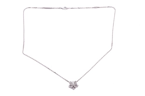 Lot 304 - Van Cleef & Arpels - a diamond-set lotus...