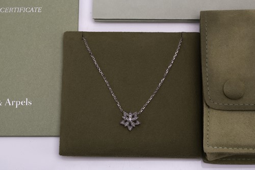 Lot 304 - Van Cleef & Arpels - a diamond-set lotus...
