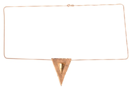Lot 159 - An abstract triangular pendant on chain, the...