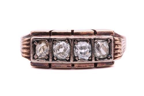 Lot 156 - An old cut diamond four stone ring, set with a...
