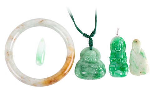 Lot 129 - A Chinese jade bangle and other four carved...
