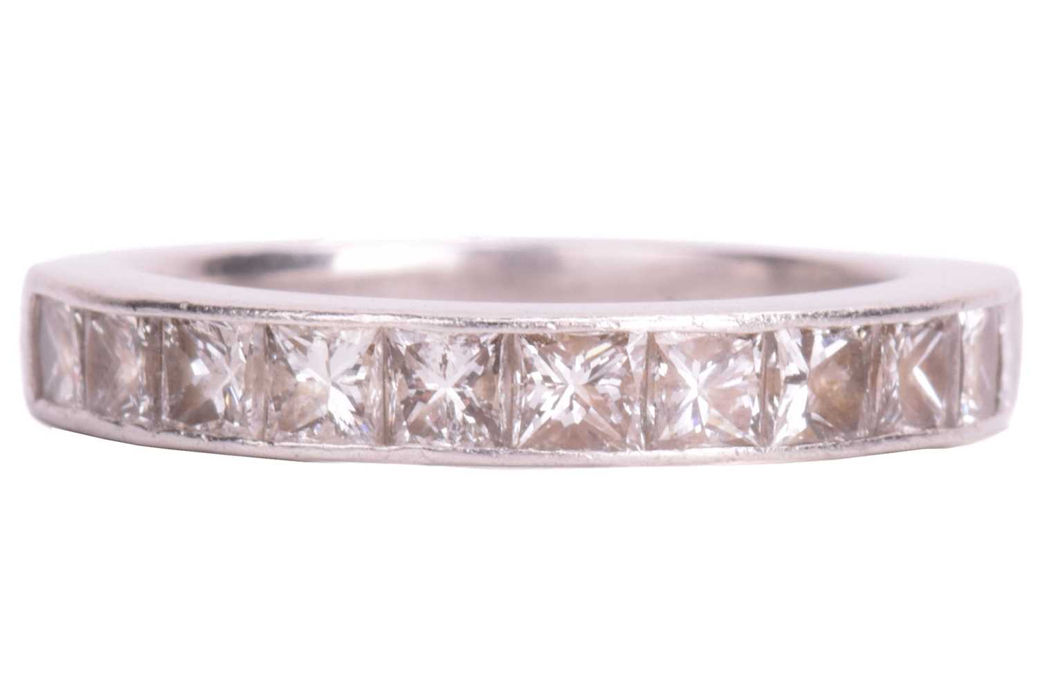 Lot 74 - A diamond half-eternity ring in platinum,...