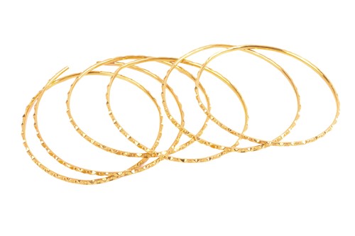 Lot 43 - A set of six Indian bangles, together with a...
