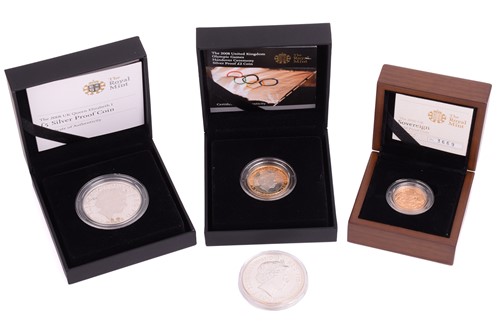 Lot 397 - Four coins including an Elizabeth II 2010 gold...