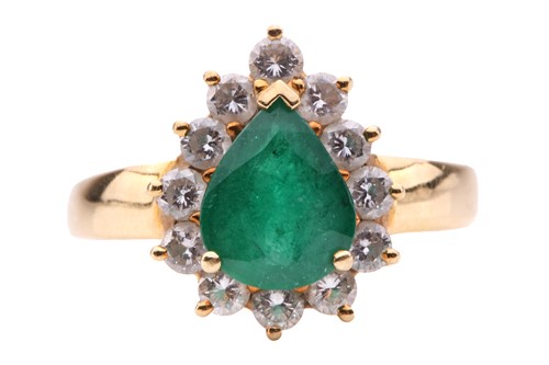Lot 80 - An emerald and diamond cluster ring, the...