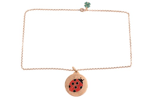 Lot 75 - A ladybird pendant necklace, the circular disc...