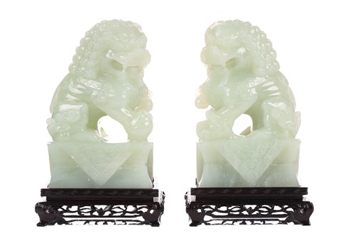 Lot 118 - A pair of Chinese bowenite carved dogs of foo,...
