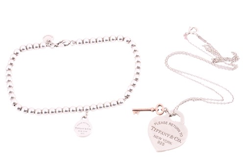 Lot 231 - Tiffany & Co. - a Return To Tiffany round tag...