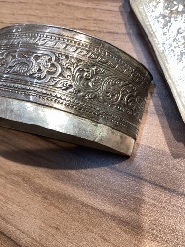 Lot 130 - A 19th-century South Burmese silver crescent...