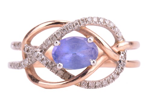 Lot 26 - A tanzanite and diamond dress ring in a knot...