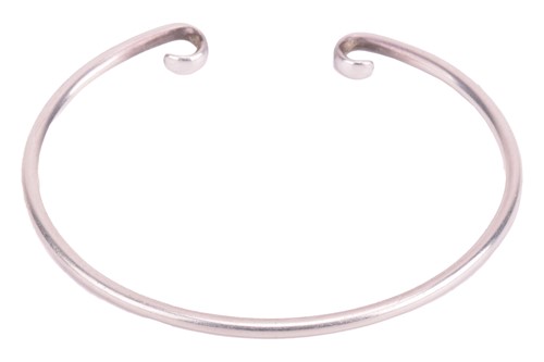 Lot 80 - Tiffany & Co. - a silver open bangle, with the...