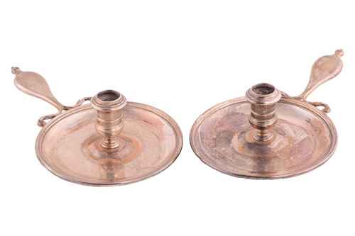 Lot 502 - A pair of Regency silver chambersticks the...