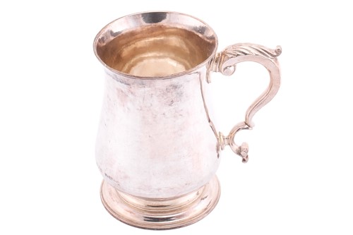 Lot 329 - A George III silver half-pint tankard; plain...