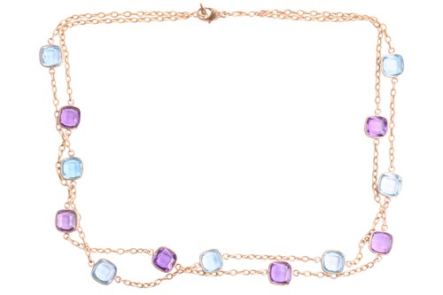 Lot 22 - An amethyst and blue topaz double strand...