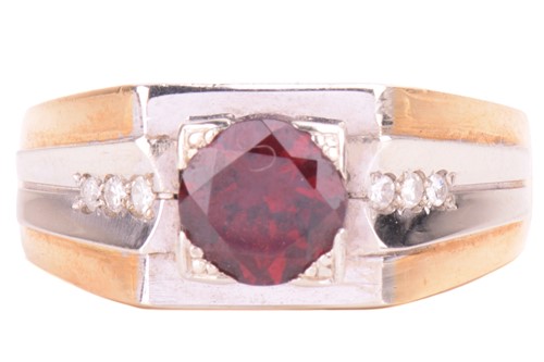 Lot 172 - A garnet and diamond angular dress ring in...