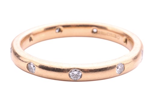 Lot 146 - A diamond set gold ring, set with a continuous...