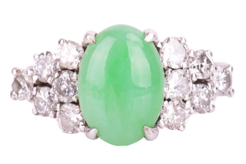 Lot 123 - A jade and diamond dress ring, centred with an...