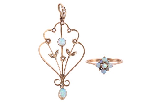 Lot 245 - An opal pendant and an opal ring; the pendant...