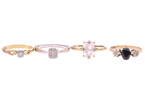 Lot 31 - A collection of four gem set rings, including...