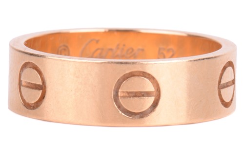 Lot 204 - Cartier - an 18ct yellow gold 'Love' ring,...